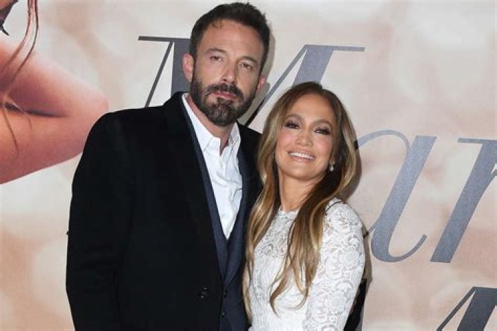 Jennifer Lopez Reveals Toned Abs In Strapless Beige Bandeau Top & Matching Pantsuit — Photos