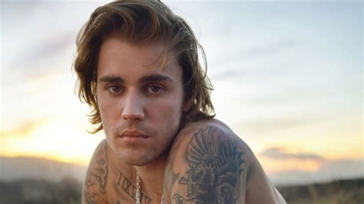 Justin Bieber Shows Off His Chest Tattoos & Controversial Dreadlocks In New Shirtless Pic