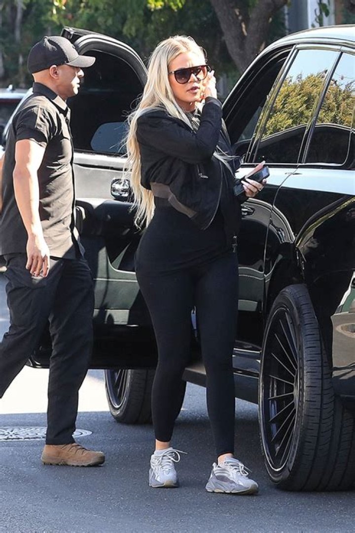Khloe Kardashian Rocks A Face Full Of Makeup & Plunging Top For Sweaty 6AM Workout