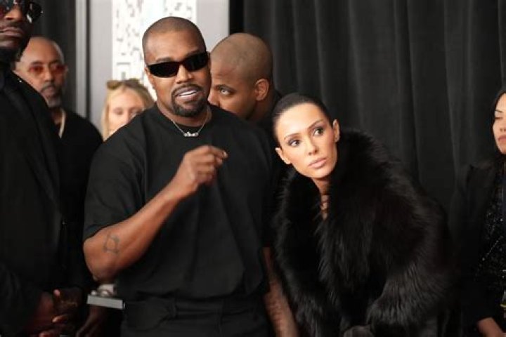 Kim Kardashian Looks Happy While Cuddling With Hairstylist Tae As Kanye West Is Seen Without Wedding Ring