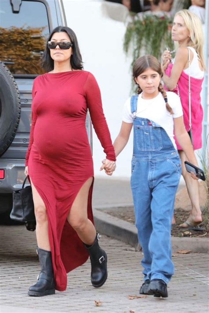Kourtney Kardashian Debuts Baby Bump In A Sexy String Bikini