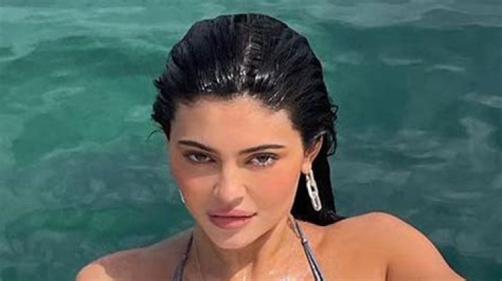 Kylie Jenner Lounges In Sexy Silver Swimsuit While Soaking In The Sun Lakeside