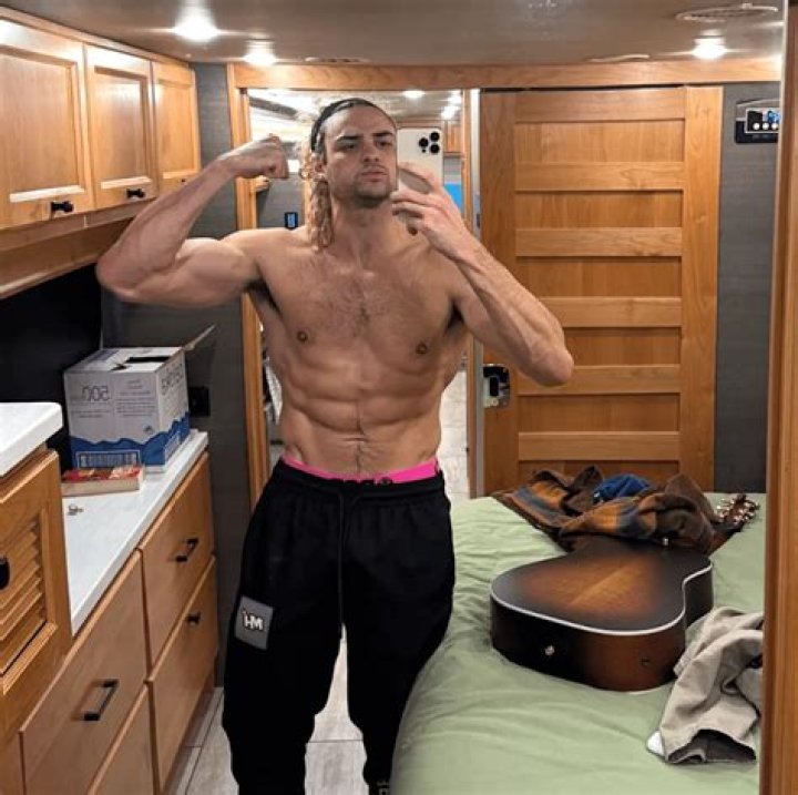 Noah Centineo Debuts New Massive Muscles & Super Curly Hair In Sexy Shirtless Videos