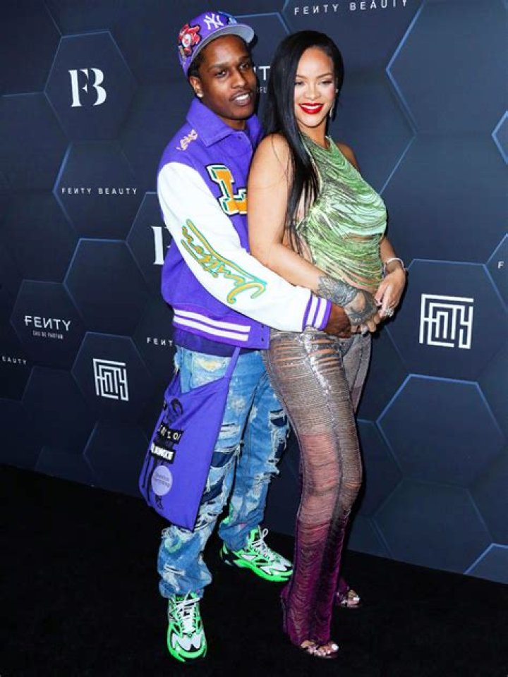Rihanna Displays Bare Baby Bump In Tiny Snakeskin Crop Top After Returning From PFW