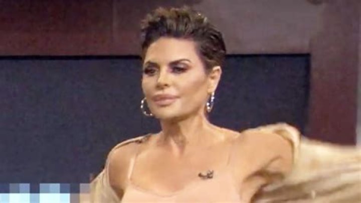 Strips To Reveal Her Shapewear In Video – Hollywood Life