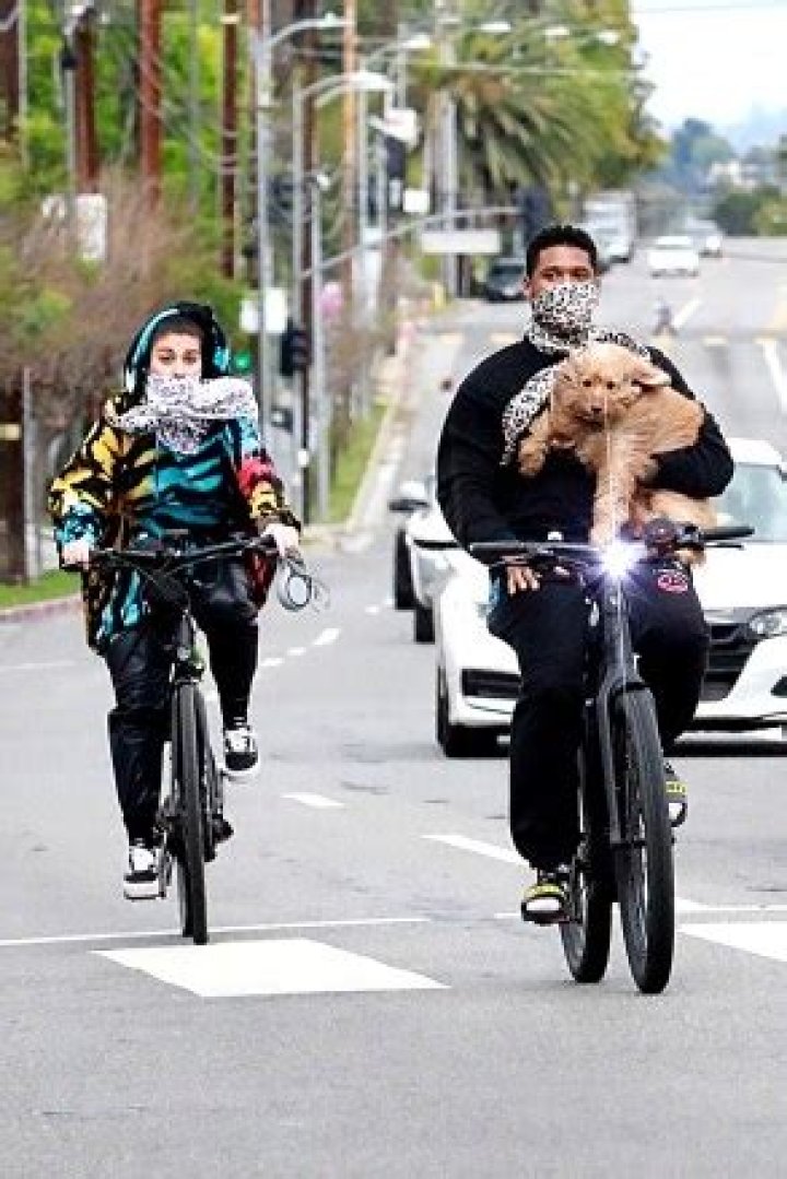 Usher Cradles His Dog In His Arms On Bike Ride With His GF — See Pics